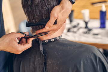 Making fashionable haircut using special hairdresser equipment
