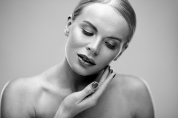 Obraz premium Beauty portrait of young woman with healthy skin and soft natural make up. Spa and care. Long beautiful blonde hair