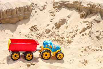 toy tractor on the sea sand