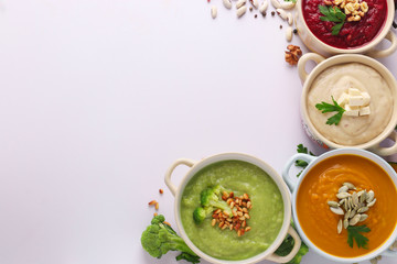 Variety of vegetables cream soups with broccoli, white beans, beet and pumpkin, ingredients for soup, Healthy eating concept, Closeup, Top view, Space for text