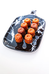 Canele is a small French pastry with rum and vanilla