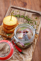 Home-salted Atlantic herring served 
with brown bread toasts and baked potato