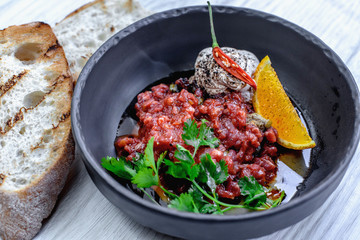 Classic tar tar with orange and sauce