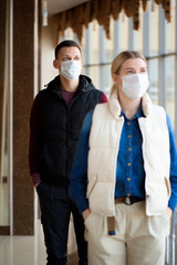 Concept of coronavirus quarantine. MERS-Cov, Novel coronavirus, man and woman with medical face mask