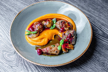 Pumpkin cream with mushrooms and veal