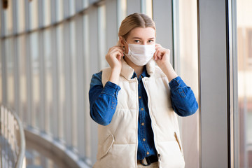 Coronavirus and Air pollution pm2.5 concept. Woman using mask for protection pm2.5 in airport terminal.Wuhan coronavirus and epidemic virus symptoms