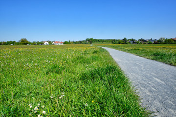 Landscape with a beautiful natural springtime meadow on the Heldenwiese in Lauf an der Pegnitz and the Kunigundenberg in the background. Seen in Germany / Bavaria in May.