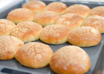Baked buns on tray. Baking at home