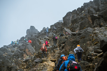 group of people hiking in mountains