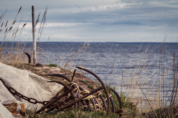 anchors for fishing nets on the shore of Lake Ladoga, Leningrad region, Russia