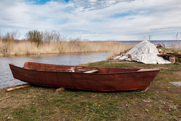 fishing metal boat ashore lake, Leningrad region, Russia