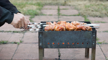 Pork kebab is fried on a grill