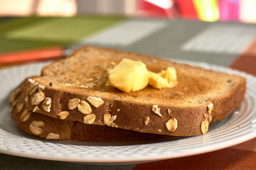 butter toast on white plate