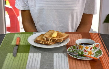 girl having breakfast toast with coffee