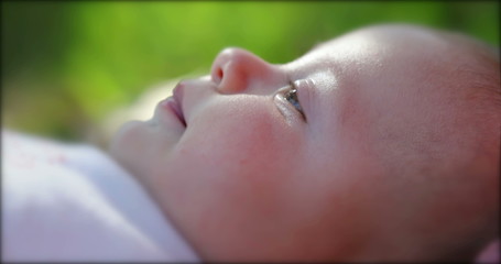 Cute baby infant newborn learning and observing about the world.