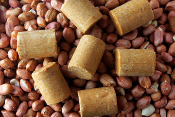 Peanut candy (paçoca) traditional Brazilian sweet based on peanuts, manioc flour and sugar on a rustic wooden table
