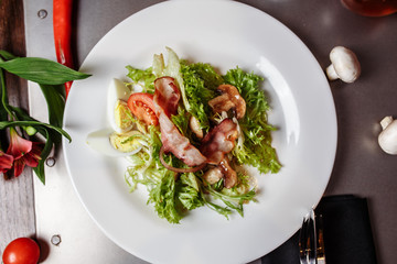 Light salad with vegetables bacon cherry grilled mushrooms tomatoes egg. delicious summer lunch