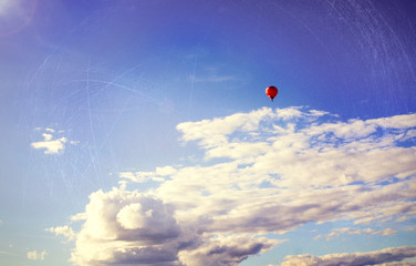 minimal style background with red balloon and clouds
