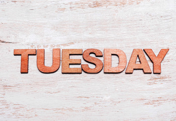 Word tuesday in wooden letters