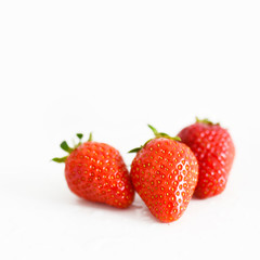 fresh strawberries bright red new crop on a white background