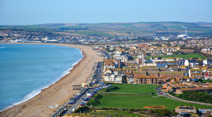 Panoramic view of Seaford, a small coastal resort town in East Sussex, UK, from the Seaford Head, with its long beach. Seaford lies on the south coast of England, close to Seven Sisters cliffs