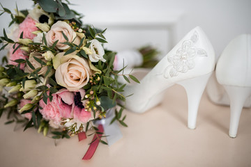 composition of a bouquet and shoes of the bride