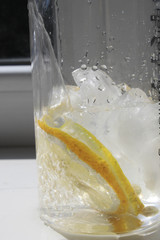 Water with ice and lemon in a glass