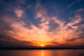 Obraz premium Orange sunset over the river