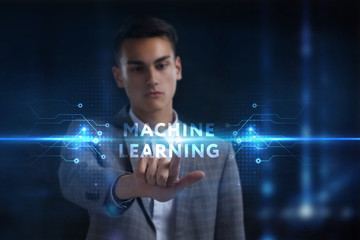 Business, Technology, Internet and network concept. Young businessman working on a virtual screen of the future and sees the inscription: Machine learning