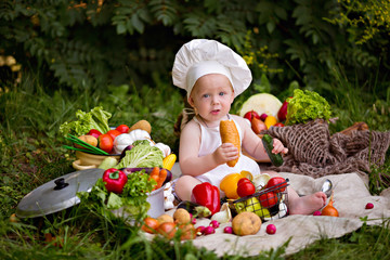 Healthy eating Happy little boy is preparing a vegetable salad. Cook.