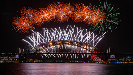 Fototapeta premium NYE fireworks on Sydney Harbour Bridge. Western view from Blues Point Reserve.