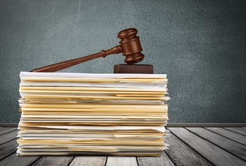 Judge wooden hammer and stack documents