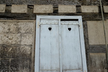 old wooden door decorated with hearts
