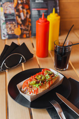 Street food on a wooden table on a sunny day