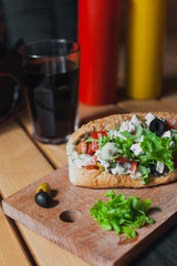 Street food on a wooden table on a sunny day