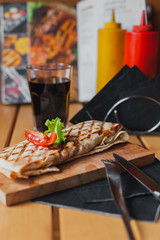 Street food on a wooden table on a sunny day
