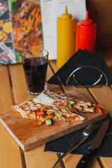 Street food on a wooden table on a sunny day