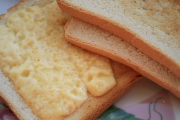 Several pieces of bread with cheese