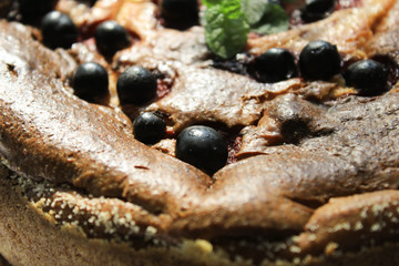Pie with berries on the windowsill