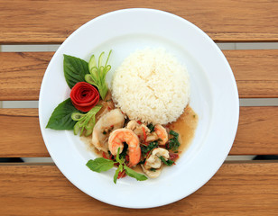 Rice with stir-fried mixed seafood and basil.