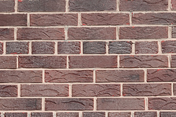 Brown background of beautiful unusual building brick