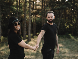 Happy couple walking in the woods