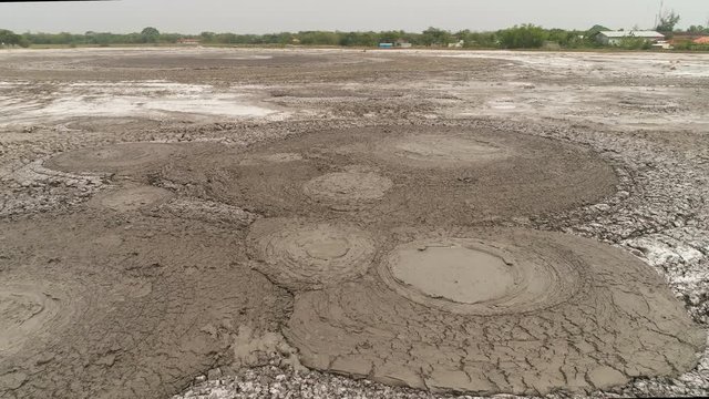 Mud volcano bledug kuwu. aerial view volcanic plateau with geothermal activity and geysers, Indonesia java. aerial view volcanic landscape