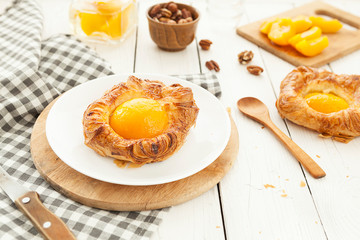 tartlet with apricot, sweet pastries on a white background, pastry shop.