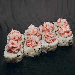 Felix roll with shrimp on a black plate