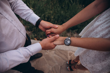 Happy couple holding hands