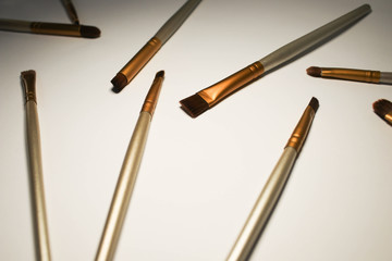 Makeup brushes on a white background
