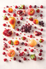 Red food pattern. Wallpaper abstract composition of fruits. Healthy food concept, top view.