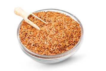 Bowl full of brown flax seed isolated on white background