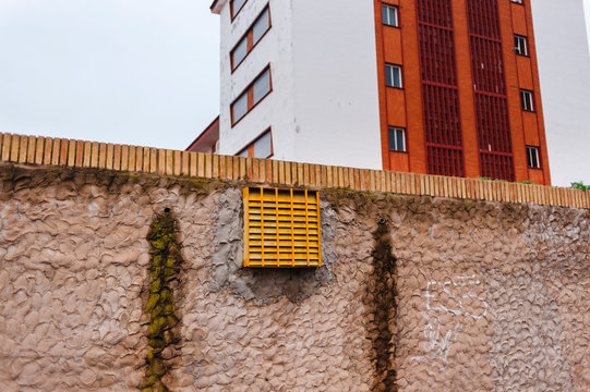 Low angle view of terraces and windows in modern buildings on cloudy day